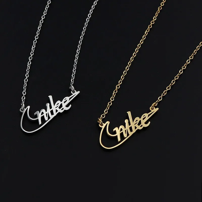 NIKE SWOOSH Logo Halskette - silber / gold - neu - Geschenk